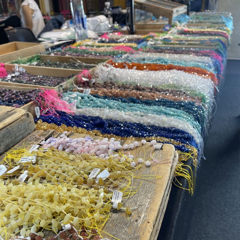 Gemstone strands as seen in the Dakota Stones booth during the Tucson Gem & Mineral Shows